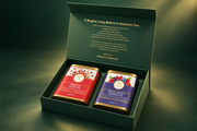 Alfuzon forest-green gift box and two tea tins on a deep green backdrop