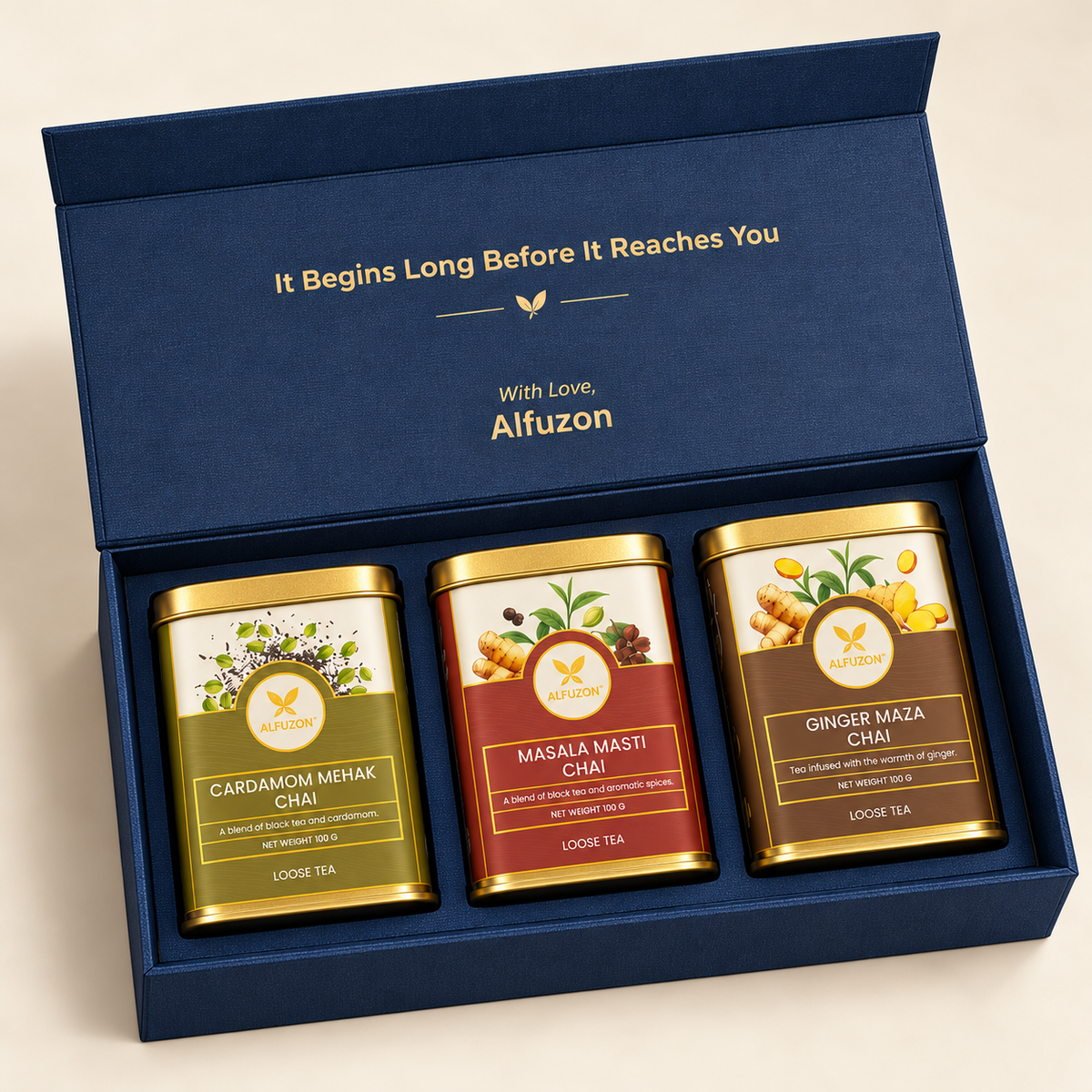 Angled view of the navy Alfuzon gift box with three 100 g chai tins