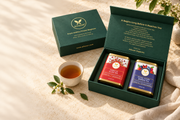 Illustrative Alfuzon two-tea gift box on an ivory table with a cup of tea; cup and props not included