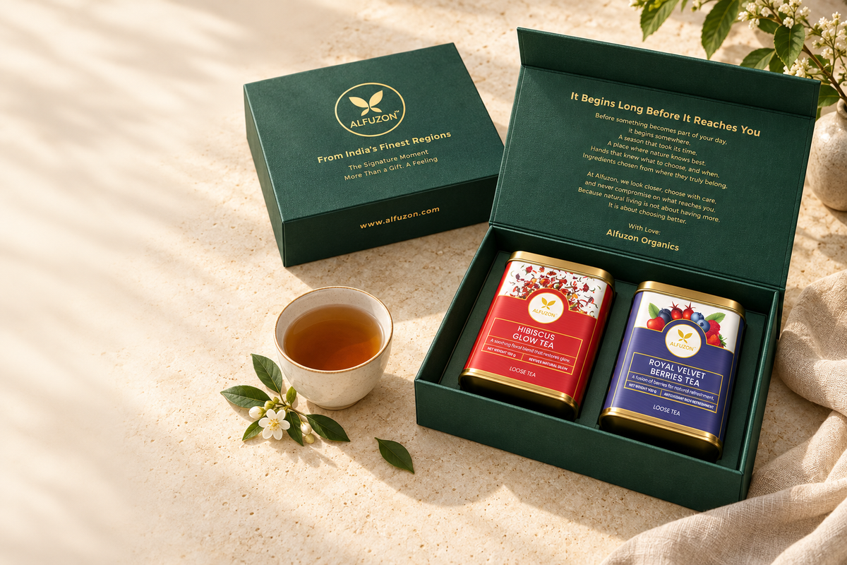 Illustrative Alfuzon two-tea gift box on an ivory table with a cup of tea; cup and props not included